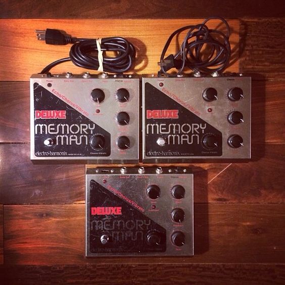 Collection of three generations of the Electro Harmonix Deluxe Memory Man.